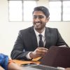 Sri Lankan businessman in meeting with mature woman in office